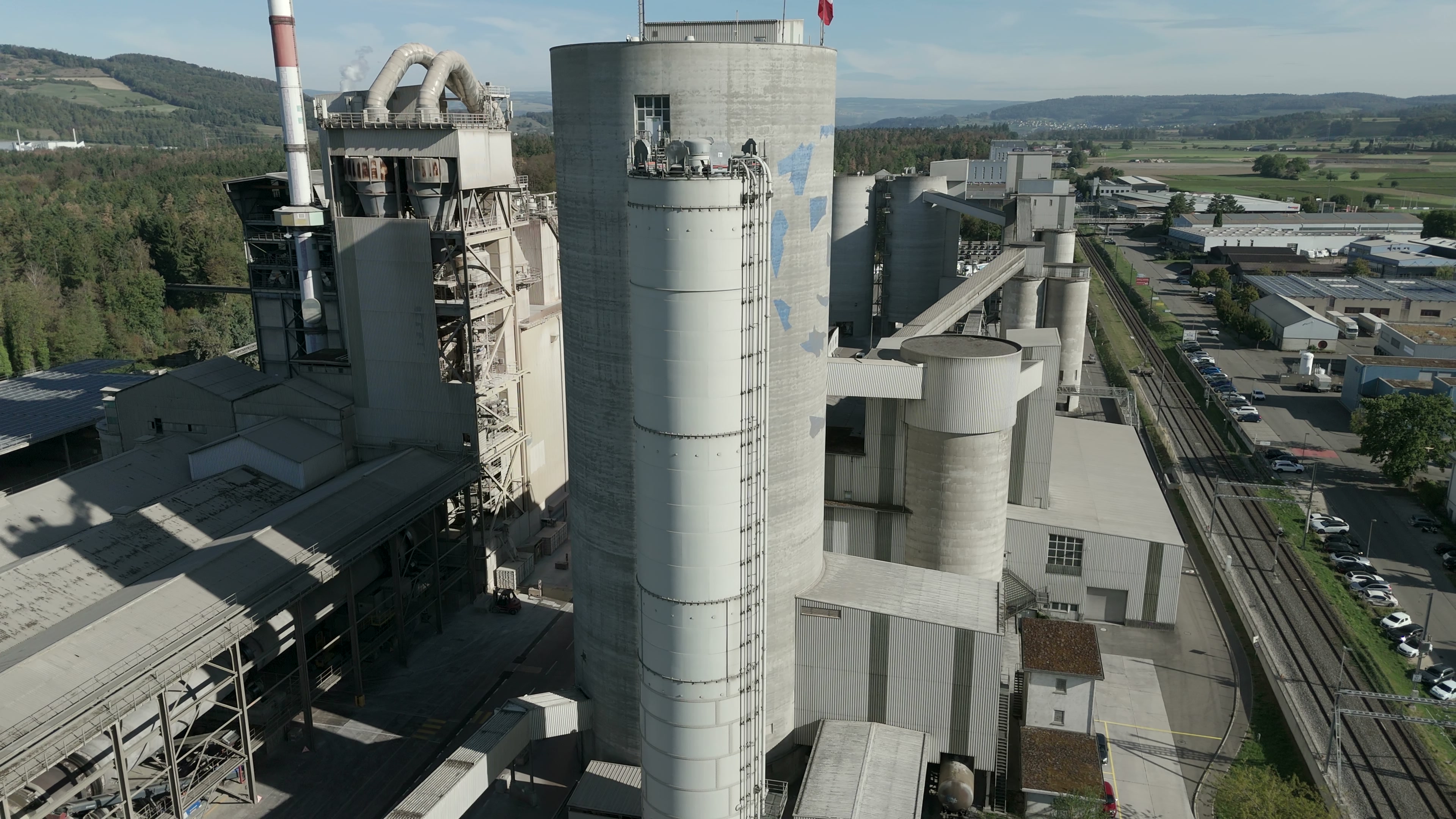 Aerial view showing the scale of Holcim’s cement works, silos and production buildings